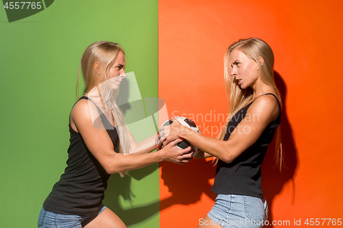 Image of Fan sport woman player holding soccer ball