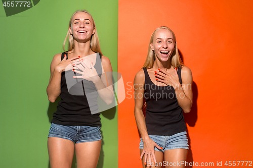 Image of The happy business women standing and smiling