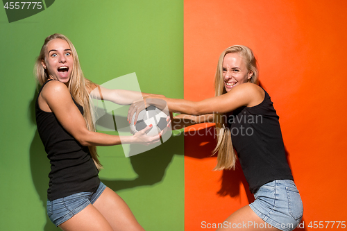 Image of Fan sport woman player holding soccer ball