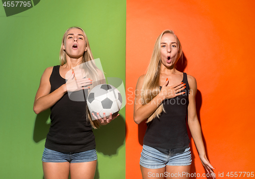 Image of Fan sport woman player holding soccer ball