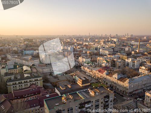 Image of The panoramic bird\'s eye view from drone to the central historical part of the city Kiev - the Podol district, the Dnieper River in Kiev, Ukraine at summer sunset.