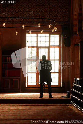 Image of male Muslim praying in the mosque