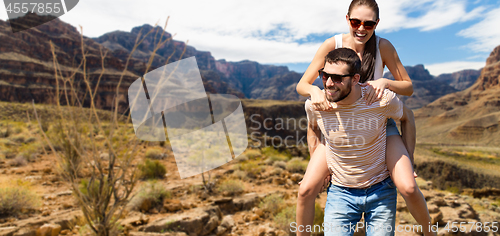 Image of couple having fun in summer over grand canyon