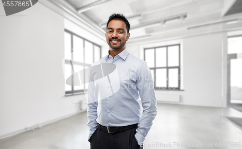 Image of indian businessman or realtor in empty office room