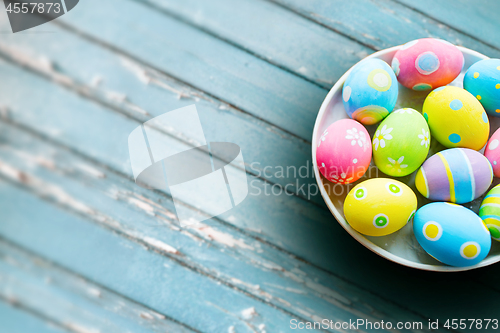 Image of close up of colored easter eggs on plate