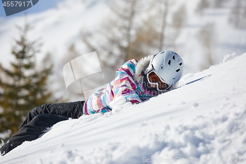 Image of Skier having a rest in the snow