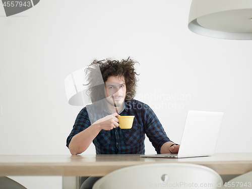 Image of man working from home