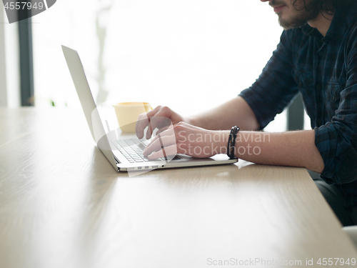 Image of man working from home