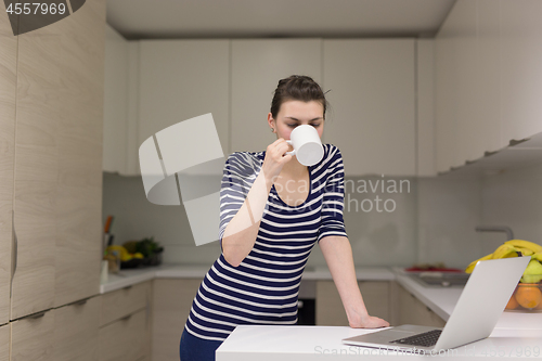 Image of woman drinking coffee enjoying relaxing lifestyle