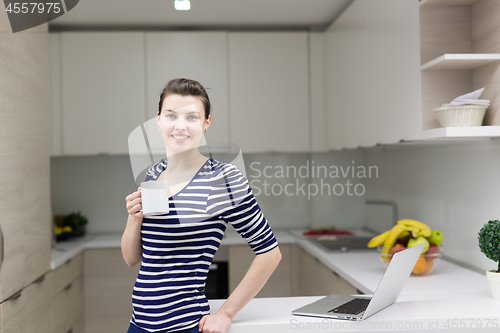 Image of woman drinking coffee enjoying relaxing lifestyle