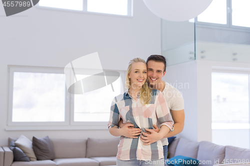 Image of couple hugging in their new home