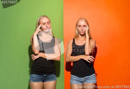 Image of Women having headache over studio background.