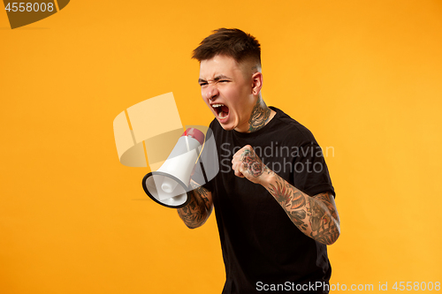 Image of man making announcement with megaphone