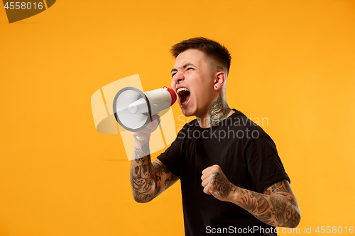 Image of man making announcement with megaphone