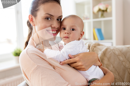 Image of happy mother with little baby boy at home