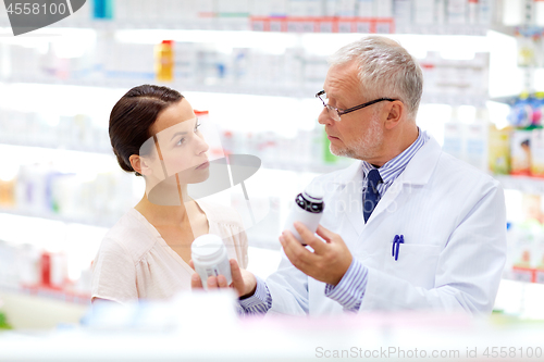 Image of apothecary and woman with drug at pharmacy