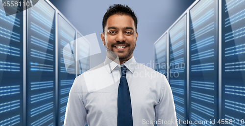 Image of indian businessman over server room