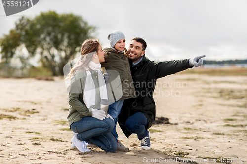 Image of happy family outdoors in autumn