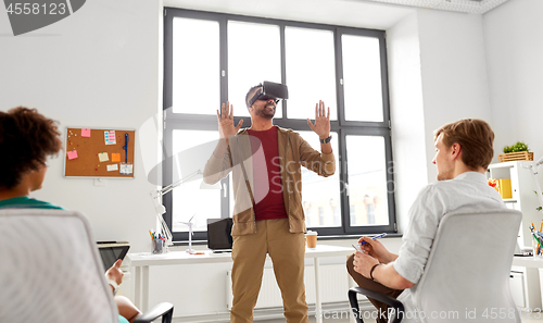 Image of developers with virtual reality headset at office