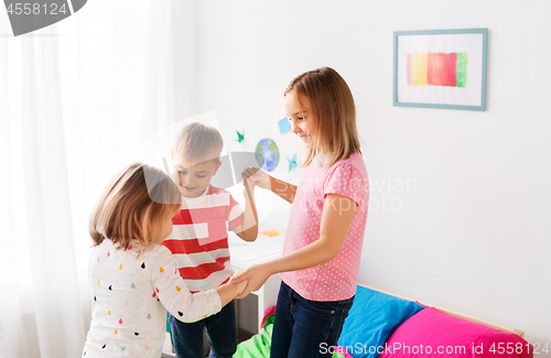 Image of happy children playing at home