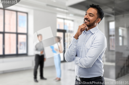 Image of indian businessman or realtor in empty office room