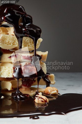 Image of syrop pouring onto a piece of chocolate