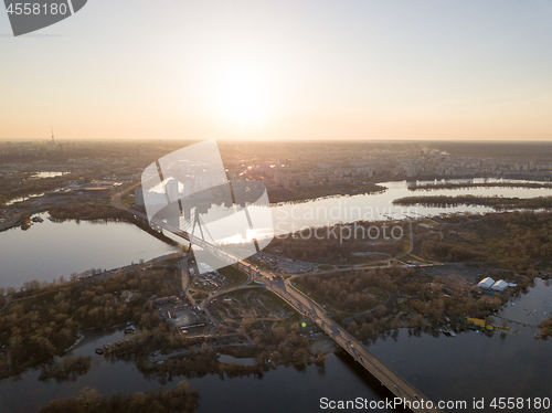 Image of The bridge over the Dnieper River and a panoramic view of the city of Kiev at sunset.