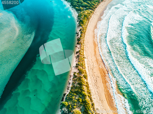 Image of River hugs the ocean arcing aerial views