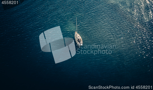 Image of Overhead views ofa small yacht on the water