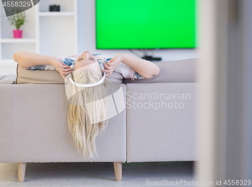 Image of girl enjoying music through headphones