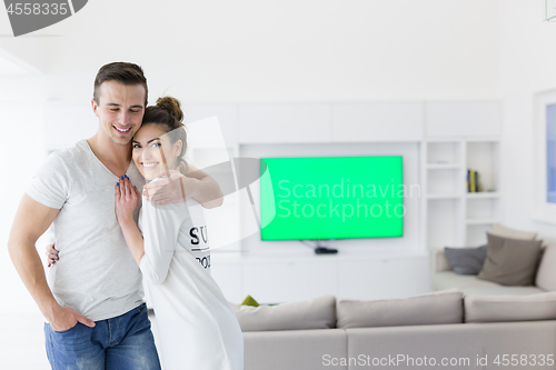 Image of couple hugging in their new home