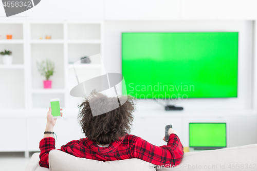 Image of young man in bathrobe enjoying free time