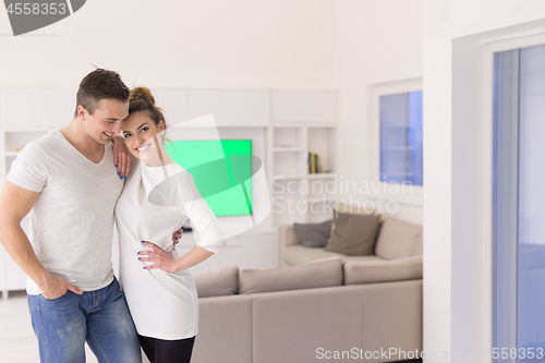 Image of couple hugging in their new home