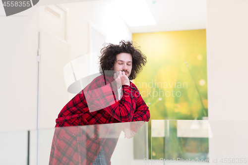 Image of portrait of young man in bathrobe