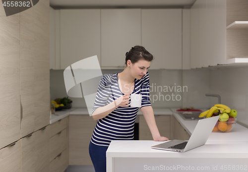 Image of woman drinking coffee enjoying relaxing lifestyle