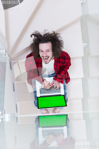 Image of freelancer in bathrobe working from home