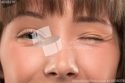 Image of The close up eyes on face of young beautiful caucasian girl