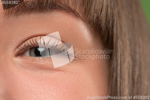 Image of The close up eye on face of young beautiful caucasian girl