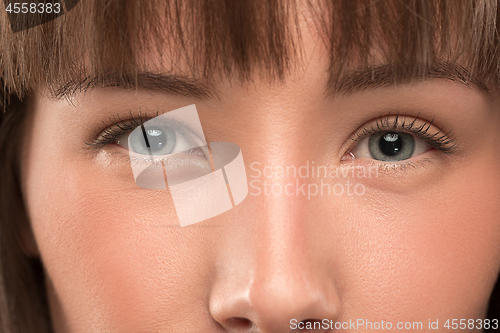 Image of The close up eyes on face of young beautiful caucasian girl