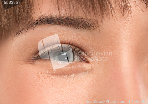 Image of The close up eye on face of young beautiful caucasian girl