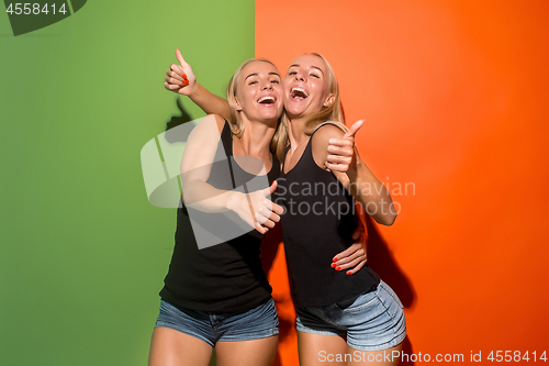 Image of The happy business women standing and smiling