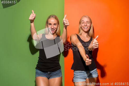 Image of The happy business women standing and smiling