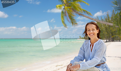 Image of happy woman over tropical beach background