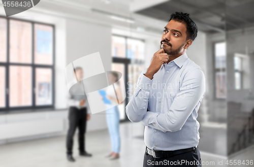 Image of indian businessman or realtor in empty office room