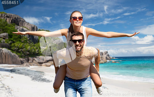 Image of happy couple having fun on seychelles island