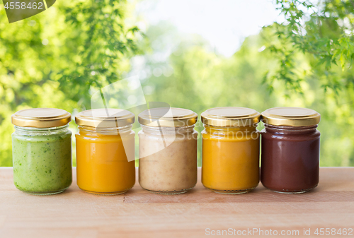 Image of vegetable or fruit puree or baby food in jars