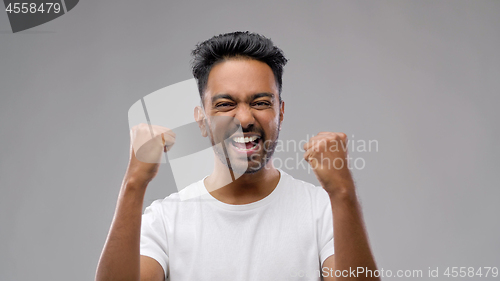 Image of indian man celebrating victory