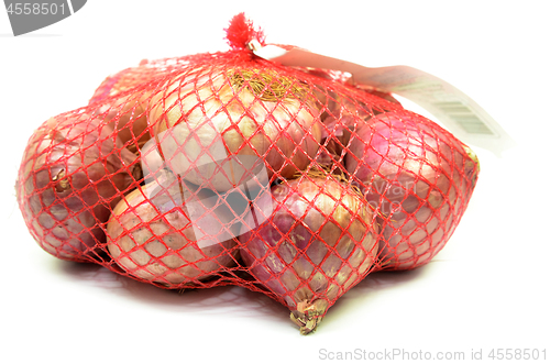 Image of Pack of red onions isolated