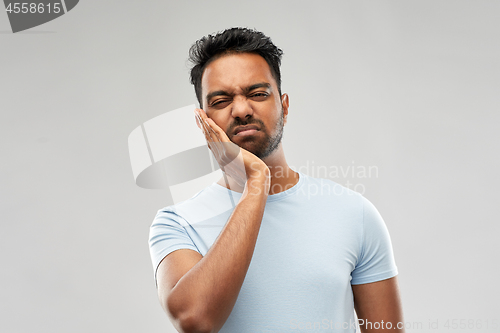 Image of indian man suffering from toothache