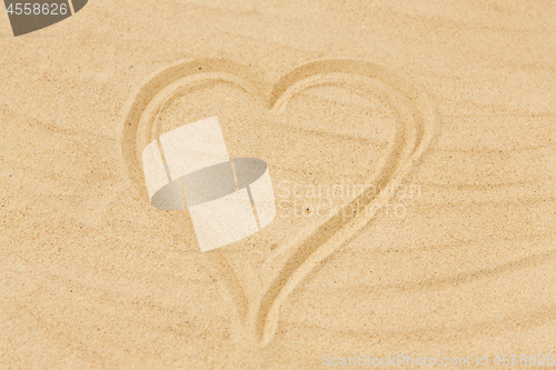 Image of picture of heart in sand on summer beach